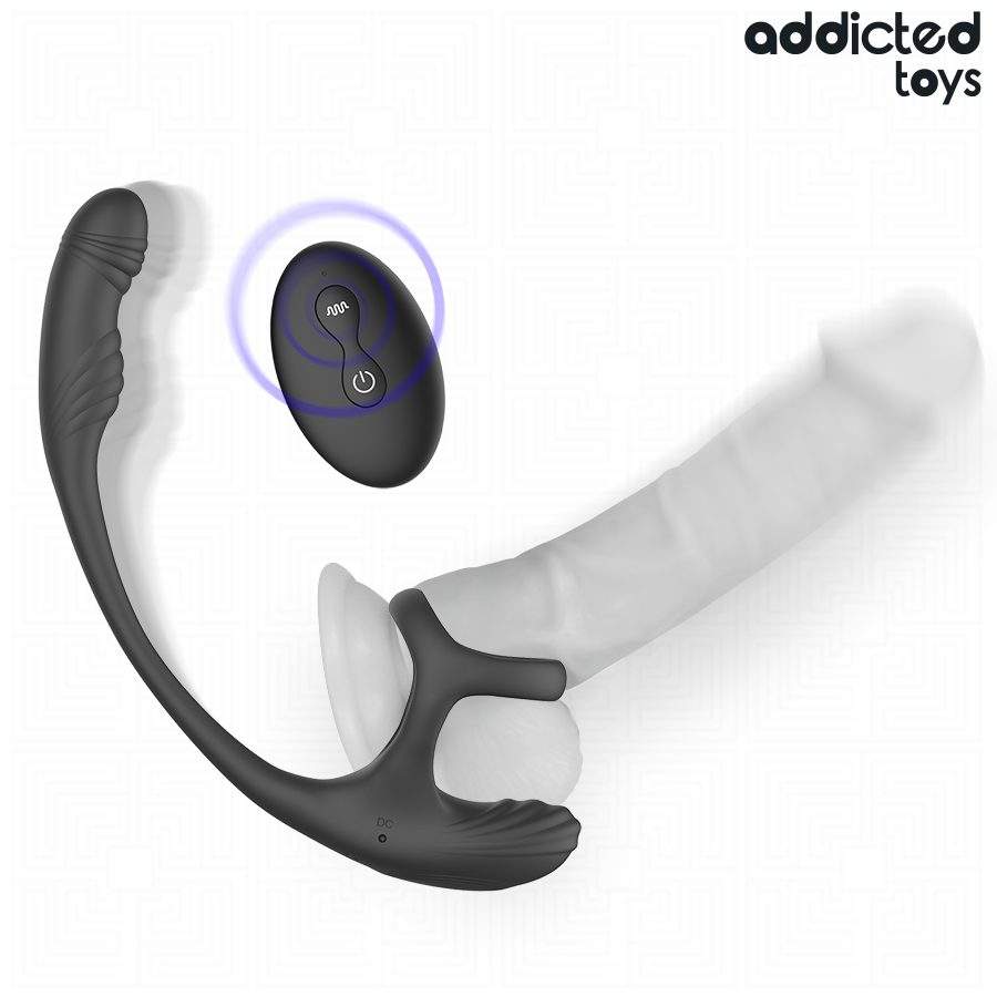 Stimulateur prostatique Addicted Toys positionné autour d'un gode, télécommande au premier plan